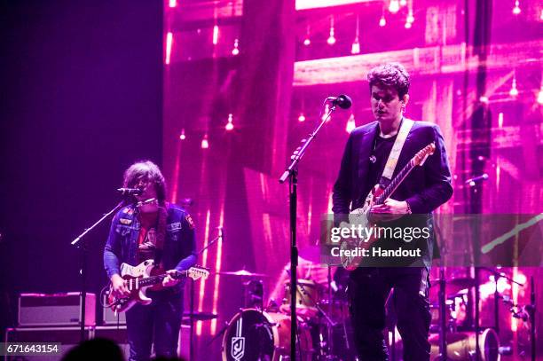 In this handout photo provided by Forum Photos, Ryan Adams and John Mayer perform at The Forum on April 21, 2017 in Inglewood, California.