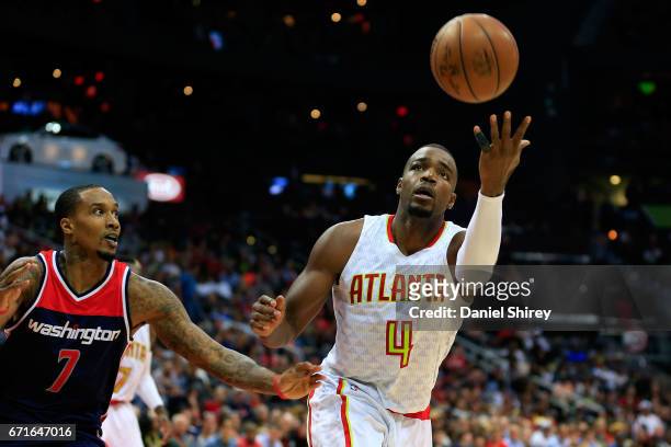 Paul Millsap of the Atlanta Hawks grabs a rebound before Brandon Jennings of the Washington Wizards during the fourth quarter in Game Three of the...