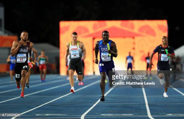 Andre De Grasse of Canada and Justin Gatlin of the USA run to the finishline in heat two of the Men's 4 x 100 Meters Relay during the IAAF/BTC World...