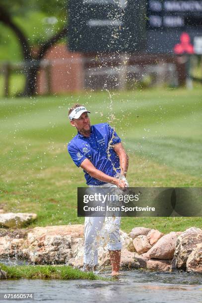 Ian Poulter hits a shot out of the hazard during the second round of the Valero Texas Open at the TPC San Antonio Oaks Course in San Antonio, TX on...