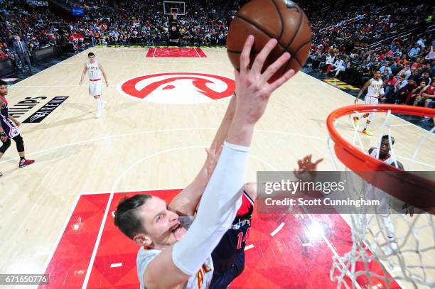 Mike Muscala of the Atlanta Hawks dunks the ball during the game against the Washington Wizards in Game Three of the Eastern Conference Quarterfinals...