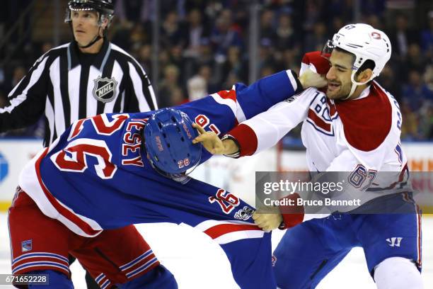 Jimmy Vesey of the New York Rangers fights with Max Pacioretty of the Montreal Canadiens during the first period in Game Six of the Eastern...