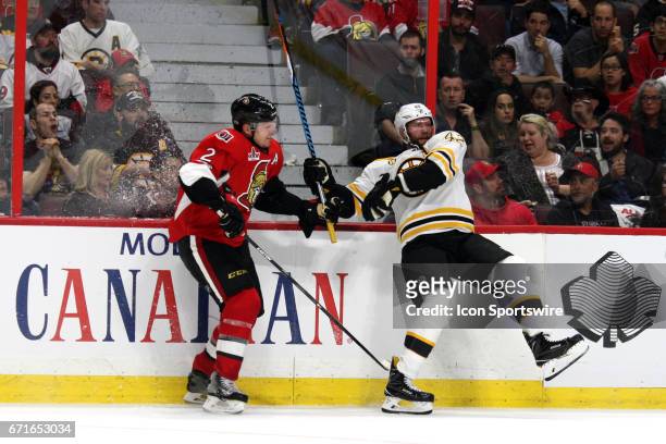 Ottawa Senators Defenceman Dion Phaneuf and Boston Bruins Right Wing David Backes collide in the third period of game 2 of the first round of the...