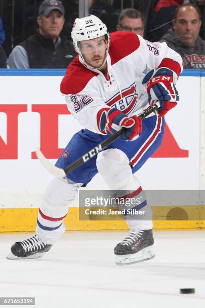 Brian Flynn of the Montreal Canadiens skates with the puck against the New York Rangers in Game Six of the Eastern Conference First Round during the...
