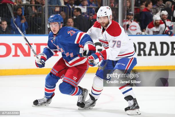Jimmy Vesey of the New York Rangers skates against Andrei Markov of the Montreal Canadiens in Game Six of the Eastern Conference First Round during...