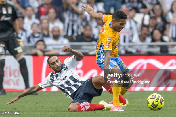 Javier Aquino of Tigres fights for the ball with Edgar Castillo of Monterrey during the 15th round match between Monterrey and Tigres UANL as part of...