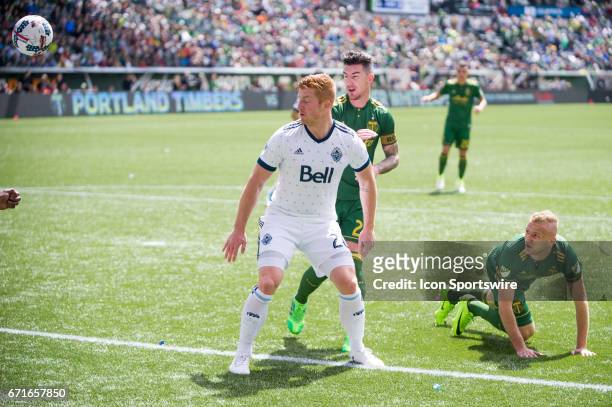 Vancouver Whitecaps defender Tim Parker anticipates a cross to Portland Timbers defender Liam Ridgewell during the Portland Timbers home victory 2-1...