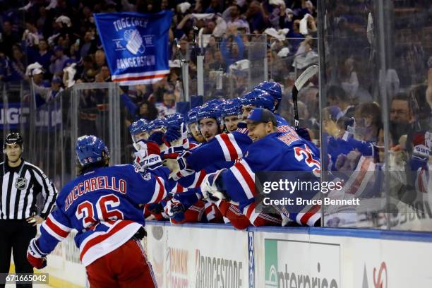 Mats Zuccarello of the New York Rangers celebrates with his teammates after scoring his second goal against Carey Price of the Montreal Canadiens...
