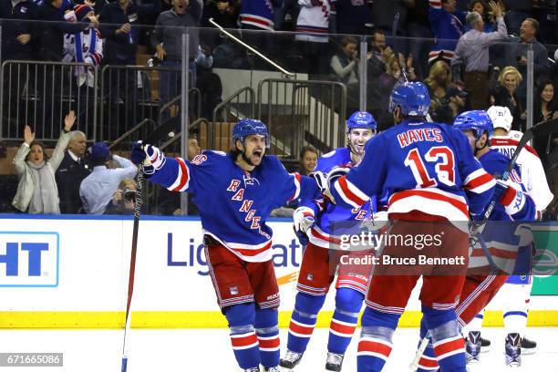 Mats Zuccarello of the New York Rangers celebrates with his teammates after scoring his second goal against Carey Price of the Montreal Canadiens...