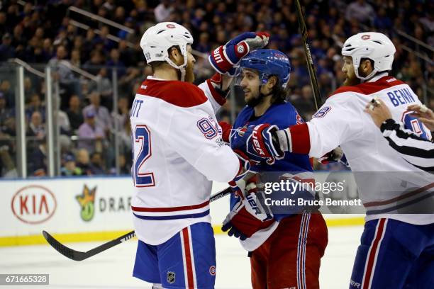 Steve Ott of the Montreal Canadiens taps Mats Zuccarello of the New York Rangers on the head during the second period in Game Six of the Eastern...