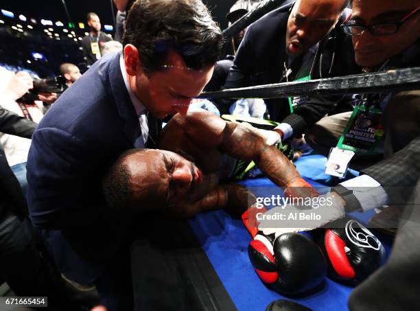 Charles Hatley is knocked out in the sixth round by Jermell Charlo during their WBC junior middleweight title bout at the Barclays Center on April...