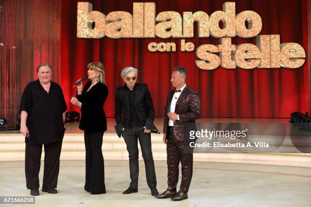 Gerard Depardieu, Milly Carlucci, Marco Castoldi aka Morgan and Paolo Belli attend the Italian TV show 'Ballando Con Le Stelle' at Auditorium Rai on...