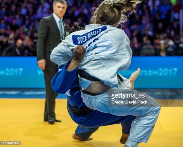 Audrey Tcheumeo of France throws Guusje Steenhuis of the Netherlands for ippon to win the u78kg gold medal during the 2017 Warsaw European Judo...