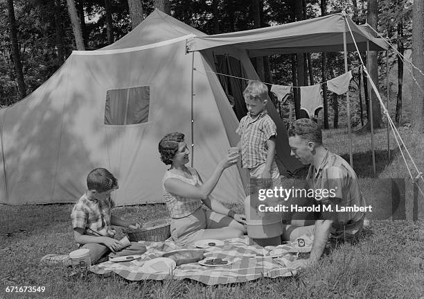 Family Having Breakfast During Camping.