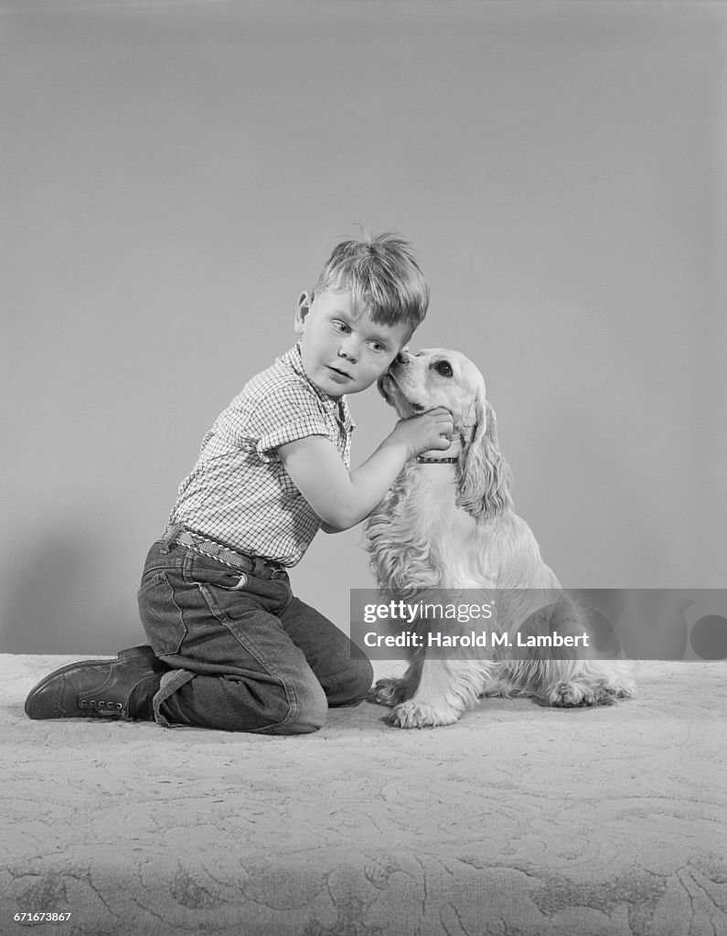  Portrait Of Boy And Dog Sitting Together