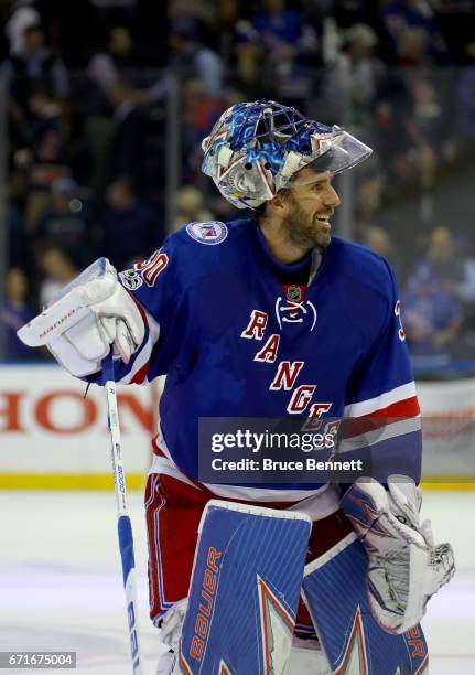 Henrik Lundqvist of the New York Rangers celebrates defeating the Montreal Canadiens in Game Six of the Eastern Conference to win the First Round...