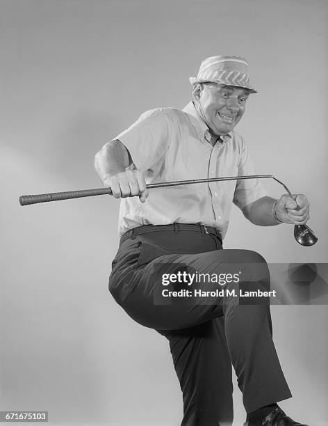 Man Breaking Golf Club.
