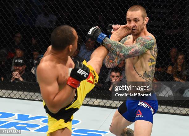 John Dodson kicks Eddie Wineland in their bantamweight bout during the UFC Fight Night event at Bridgestone Arena on April 22, 2017 in Nashville,...