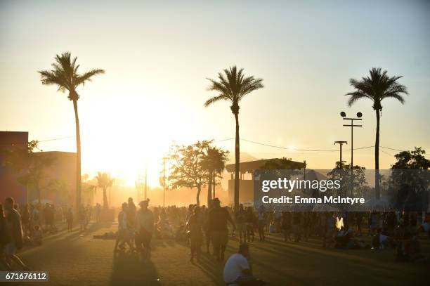 Festivalgoers are seen at sunset during day 2 of the 2017 Coachella Valley Music & Arts Festival at the Empire Polo Club on April 22, 2017 in Indio,...