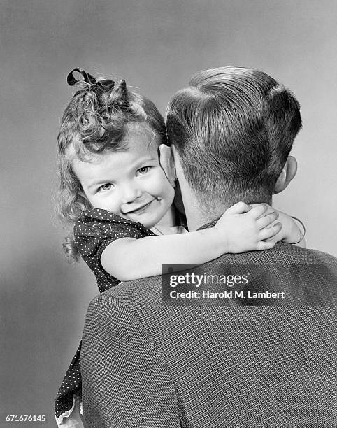 Cute Little Girl Hugging Her Father .