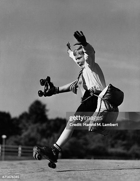 Pre-Teen Boy Falling From Roller Skates.