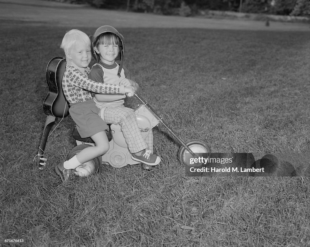  Boy And Girl Playing On Grass