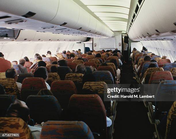 Passengers Sitting In Aeroplane .