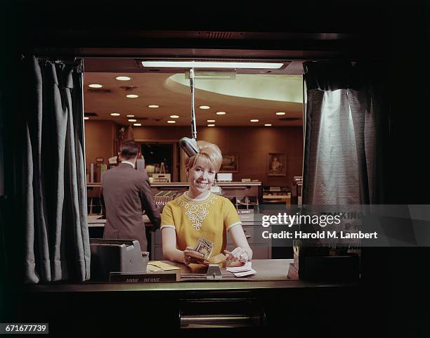 Cashier On Bank Counter Counting Cash .