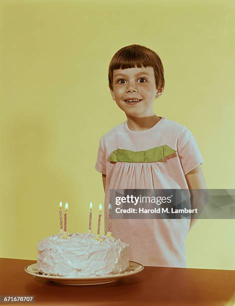 "Girl Standing With Birthday Cake, Smiling . "