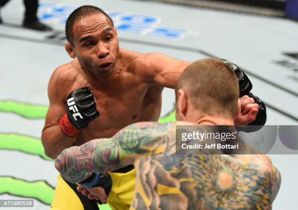 John Dodson punches Eddie Wineland in their bantamweight bout during the UFC Fight Night event at Bridgestone Arena on April 22, 2017 in Nashville,...
