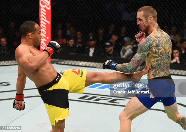 John Dodson kicks Eddie Wineland in their bantamweight bout during the UFC Fight Night event at Bridgestone Arena on April 22, 2017 in Nashville,...