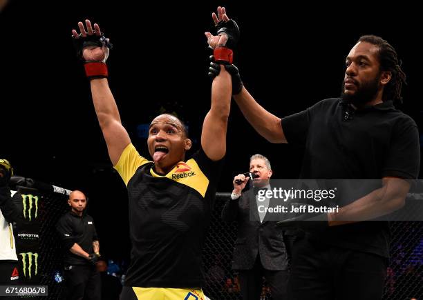 John Dodson celebrates after his unanimous-decision victory over Eddie Wineland in their bantamweight bout during the UFC Fight Night event at...