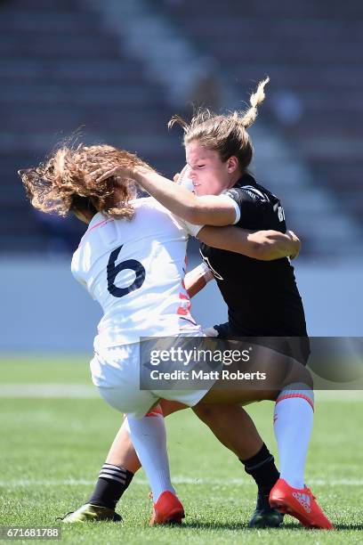 Michaela Blyde of New Zealand is tackled by KDeborah Fleming of England during the HSBC World Rugby Women's Sevens Series 2016/17 Kitakyushu quarter...