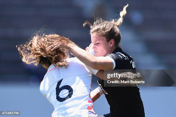 Michaela Blyde of New Zealand is tackled by KDeborah Fleming of England during the HSBC World Rugby Women's Sevens Series 2016/17 Kitakyushu quarter...