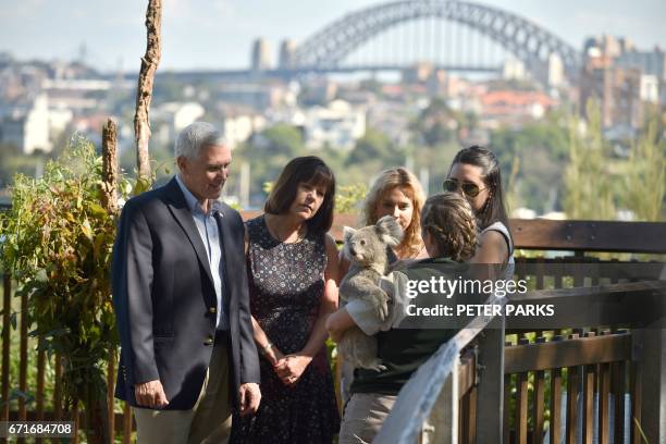 Vice President Mike Pence , his wife Karen and their daughters Audrey and Charlotte look at a koala during a visit to Taronga Park Zoo in Sydney on...