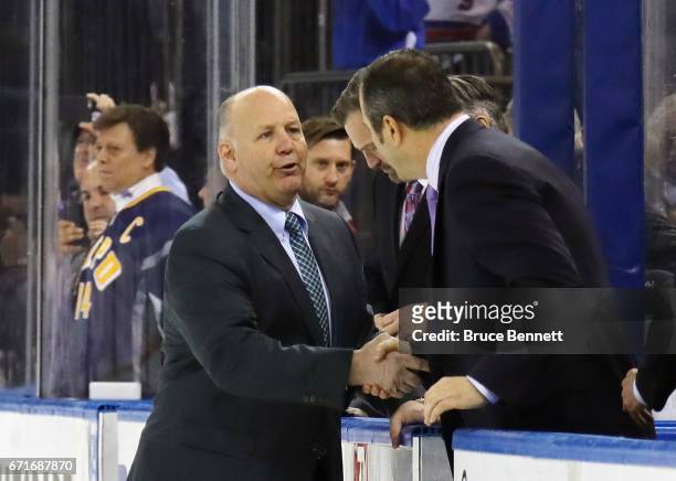 Claude Julien of the Montreal Canadiens shakes hands with Alain Vigneault of the New York Rangers after Game Six of the Eastern Conference First...