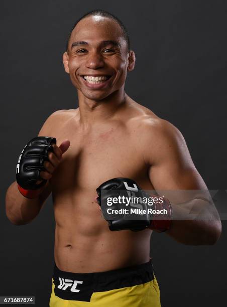 John Dodson poses for a portrait backstage after his victory over Eddie Wineland during the UFC Fight Night event at Bridgestone Arena on April 22,...