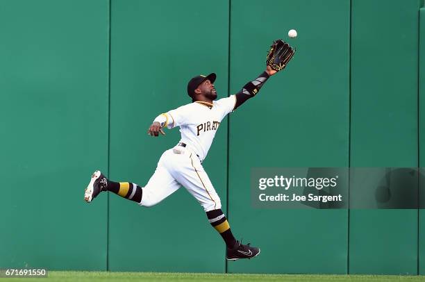 Andrew McCutchen of the Pittsburgh Pirates can't make a catch on a ball hit by Aaron Judge of the New York Yankees during the sixth inning at PNC...