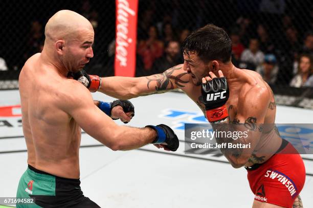 Cub Swanson punches Artem Lobov of Russia in their featherweight bout during the UFC Fight Night event at Bridgestone Arena on April 22, 2017 in...