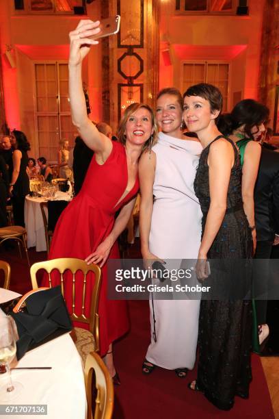 Franziska Weisz, Patricia Aulitzky and Julia Koschitz take a selfie during the ROMY award at Hofburg Vienna on April 22, 2017 in Vienna, Austria.