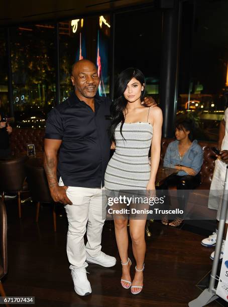 Mike Tyson and Kylie Jenner attend Sugar Factory American Brasserie at the Fashion Show mall on April 22, 2017 in Las Vegas, Nevada.