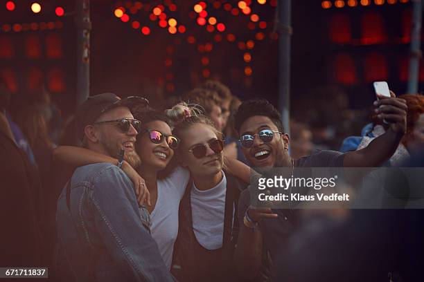 friends making selfie at concert - all men group selfie stock pictures, royalty-free photos & images
