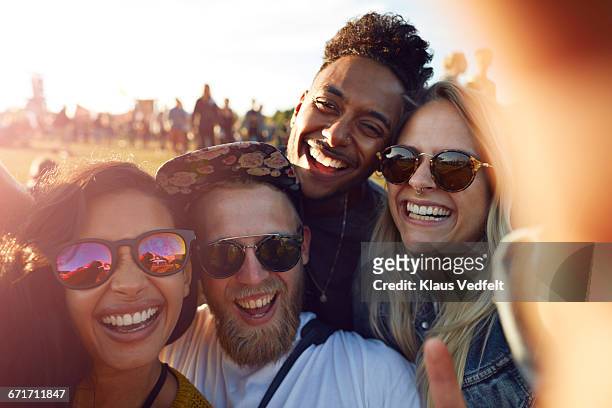 friends making selfie at big festival - four people stock pictures, royalty-free photos & images