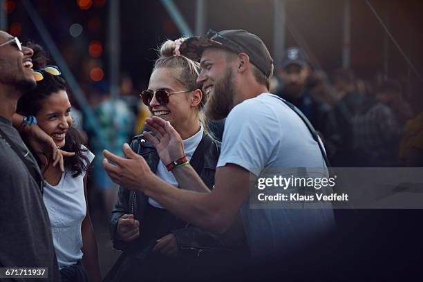 friends laughing together & clapping at concert - denmark people happy ストックフォトと画像