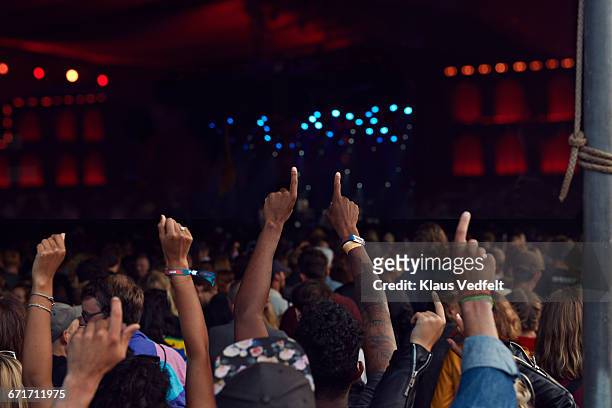 hands in the air at concert - sports round stock-fotos und bilder