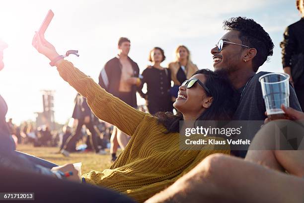 friends making selfie at big festival concert - couple concert photos et images de collection