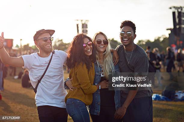 friends laughing at big festival concert - music festival day 4 foto e immagini stock