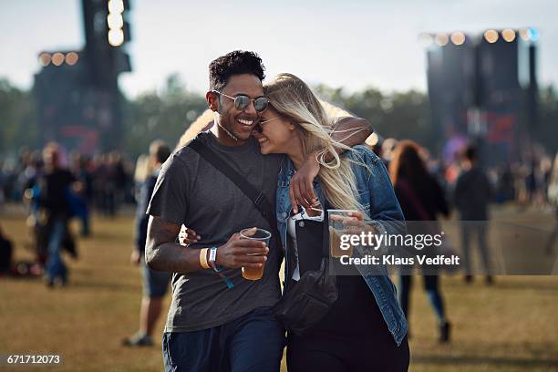 couple laughing together at concert - music festival 2016 weekend 2 stock pictures, royalty-free photos & images