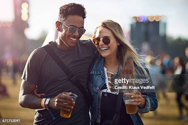 couple laughing together at concert - music festival 2016 weekend 2 stock pictures, royalty-free photos & images