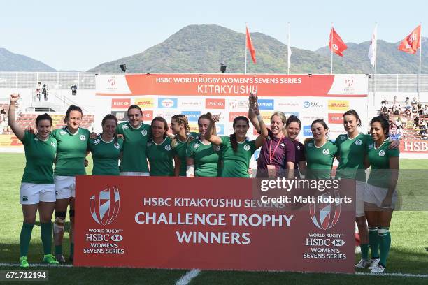 Players of Ireland celebrate victory after the HSBC World Rugby Women's Sevens Series 2016/17 Kitakyushu challenge trophy final between Ireland and...